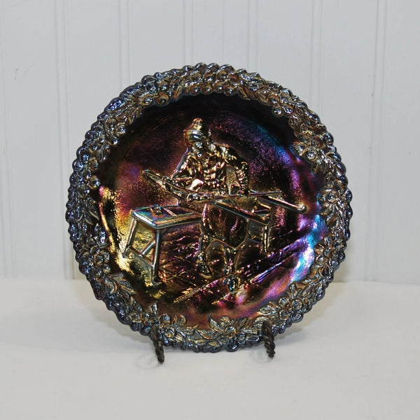Front view of the c. 1970 Fenton Art Glass Carnival Glass Plate featuring a Glassblower. The plate is number 1 in the American Craftsman Series.
