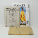 Shown are the paper instruction sheets and the uncut tissue paper sewing pattern for McCall's M6743.