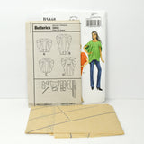Shown are the paper instructions and tissue paper sewing pattern.