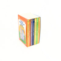 Shown are the boxed set of Seven Moomintroll Books by Tove Jansson. The seven books are paperback and each are a separate color. They are in a colorful cardboard sleeve.