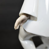 A close up of The White Clown's left hand.