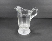 Another side view of the antique Gillinder and Sons glass creamer.
