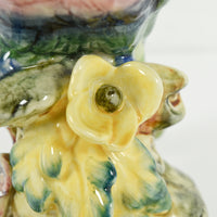 Another close up of a yellow flower that is on the base.