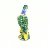 A view of the back side of the Stangl pottery cockatoo. The majority of the feathers on the back are a beautiful green.