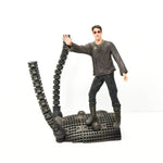 Shown is the McFarlane Toys Neo figurine standing on a curved platform with two round 'arms' coming out of the platform, on the left.