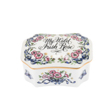 Shown is a vintage Franklin Mint porcelain music box. It is decorated in Irish pink roses and butterflies on each corner. The song title is painted on the lid. The lid is trimmed in gold paint. The lid lifts off and the turn key for the music box is inside the base.