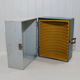 A side view of the interior of the home movie case, showing again the orange plastic 8mm home movie holder. It can hold up to 12 home movies.