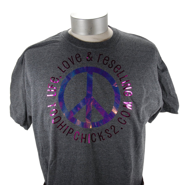 Shown is a dark heather gray t-shirt that is on a shirt form. There is a multicolor peace sign that is encircled with the words Life, Love & Reselling, TooHipChicks2.com. The t-shirt has a crew neck and short sleeves. 