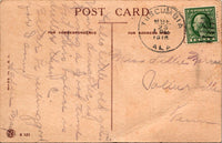 This view show the back of the c. 1910's We're mortgaged to each other postcard. This is a divided back postcard with writing allowed on the left. The postmark is from Tuscumbia, Alabama and was postmark sometime in the 1910's, the last digit of the year is blurred. The letter is addressed to Miss  Lillie Marrie? from Collierville, Tennessee. Sallie May sent the postcard. The card was Made in the USA. There is a 1 cent US postage affixed on the upper right hand corner. The stamp is green in color with Georg