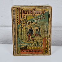 The front of the cardboard sleeve for Peter Coddle's Trip To New York game published by Peter G. Thomson. The game is circa 1882.