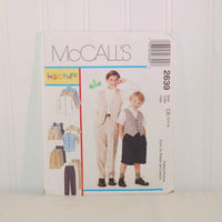 Shown is the paper envelope for McCall's 2639. It is propped up on a white background. On the front are two young buys dressed in clothes made from this pattern. The pattern is from McCall's Kid Stuff product line. On the left of the two boys are illustrated examples of clothing that can be made.