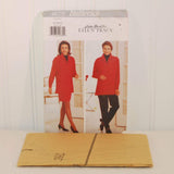 The factory folded tissue paper sewing pattern for Butterick 4679 is laying in front of the paper envelope.