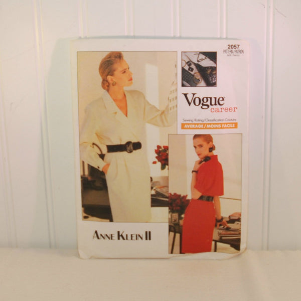 This is the front of the paper envelope for vintage Vogue 2057. It is from their Vogue Career line. It was designed by Anne Klein II. The pattern is from 1988. There are two color photos of women dressed in the dresses that can be made with this vintage pattern. The one on the left is dressed in a creamy white dress. The the other women is dressed in a red version of the dress.