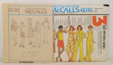 Shown propped up in front of the paper envelope and to the left is the paper instruction sheet for McCall's 6016.