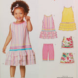 Shown is a partial view of Simplicity 6691 from their New Look Kids! pattern line. The pattern is from 2007. A young girl with light brown skin is shown wearing a sleeveless dress that can be made from this sewing pattern. To her right are illustrated pieces of clothing that can all be made.