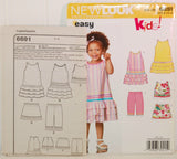 On the left, the paper instruction sheet for Simplicity 6691 is shown. Is is slightly in front of the paper envelope for the pattern.