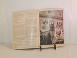 The vintage knitting booklet is shown in an open position. On the left are instructions for knitting and on the right is a black and white photo of three young women in knitted sweater vests.