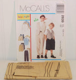 Laying in front of the propped up paper envelope for McCall's 2639 is the uncut and unused tissue paper sewing pattern.