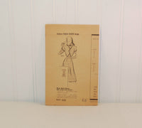 In this photo is the paper instruction sheet for the Marian Martin dress pattern Design 9377, c. 1940's.