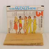 Shown laying in front of the paper envelope for McCall's 616 is the factory folded tissue paper sewing pattern.