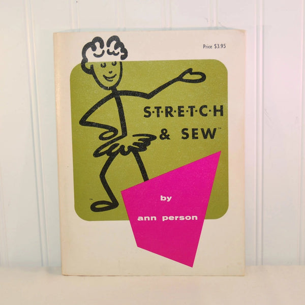 This photo show the front of the Stretch and Sew instruction book by Ann Person. The original price was $3.95! This is circa 1970. The cover has a stick figure woman in a ruffled skirt illustration. The border of the cover is white, which a green center and the author's name in a pink four sided shape.