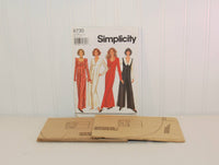 The factory folded unused tissue paper pattern is shown laying in front of the paper envelope for Simplicity 8730. 