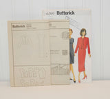 Shown are the two paper instruction sheets from Butterick 6209. They are propped up partially in front of the paper envelope.