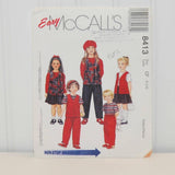 This is the front of the paper envelope for McCall's 8413 sewing pattern. It shows five different illustrated children wearing a variety of clothes that can be made from this pattern.
