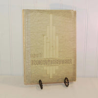 Featured is the front cover of the 1937 Norwester yearbook. The cover is a cream color and has a design in the middle and the name Norwester across the bottom of it.