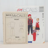 Shown is the instruction sheet for McCall's 8413. It is propped up in front of the paper envelope.