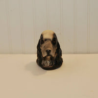 This is a view of the front of the Cocker Spaniel bookend. The dog is looking straight towards the camera. It is on a white background.