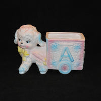 Featured is vintage Relpo Ceramic lamb pulling an ABC cart planter. It was produced circa 1950-50's. It was made in Japan. The colors are soft pastels of pink, blue and yellow on white.