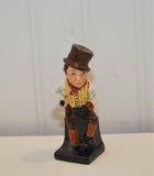 Another view of Sam Weller Royal Doulton figurine. He can be seen sitting.