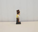 A side view of the Royal Doulton Sam Weller figurine.