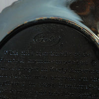 A close up of the the embossed Fenton oval logo.