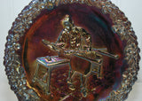 Close up of the glassblower on the Fenton Art Glass Carnival Glass plate.