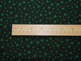There is a ruler on top of the fabric to show the size of the star pattern.