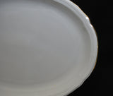 A close up of the Marie Luise pattern. There is a thin gold band of decor on the edge of the platter.