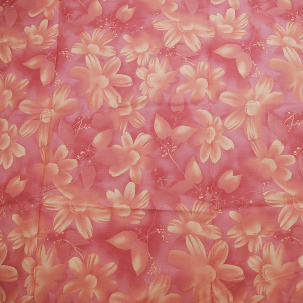This beautiful floral cotton fabric has soft shades of pink and flowers in a random pattern. The fabric was produced circa 2005.