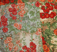 The fabric is folded over to show that the pattern is printed only on one side. The vibrant colors however can be seen on the back of the fabric.