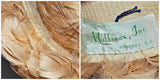 A close up of the feathers and the photo on the right is a close up of the tagged which states styled for Mullinax, Inc. Gaffney, South Carolina.