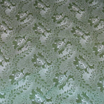 Featured is a vintage green floral fabric. There are various shades of green with subtle white accents. The flower is accent with a green vine.