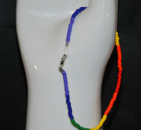 A close up of the clasp of the lgbtq ankle bracelet.